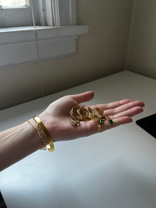 Photo of a hand holding sparkling jewellery